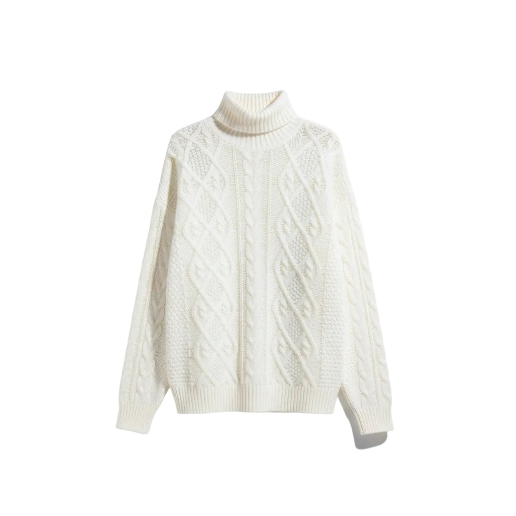 White cable knit sweater on a white background