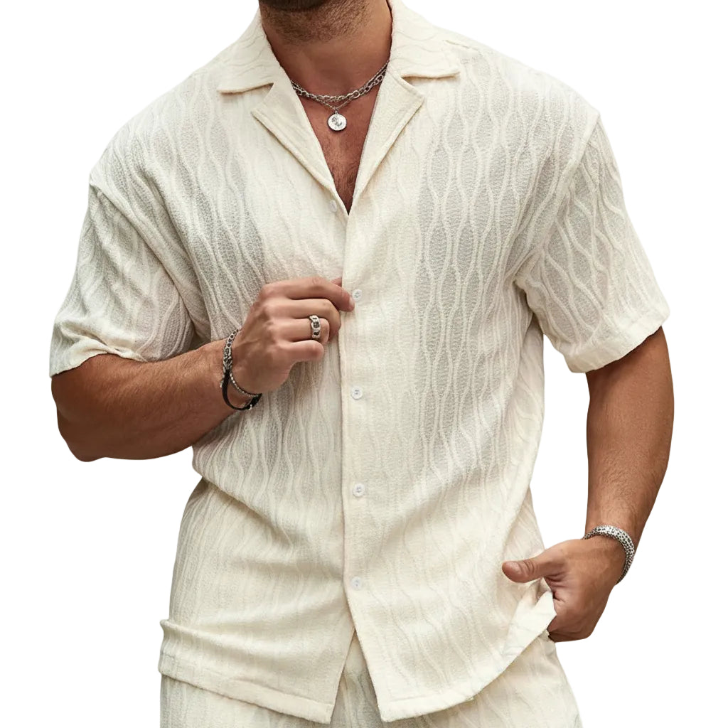 Man wearing a beige textured shirt and pants on a white background