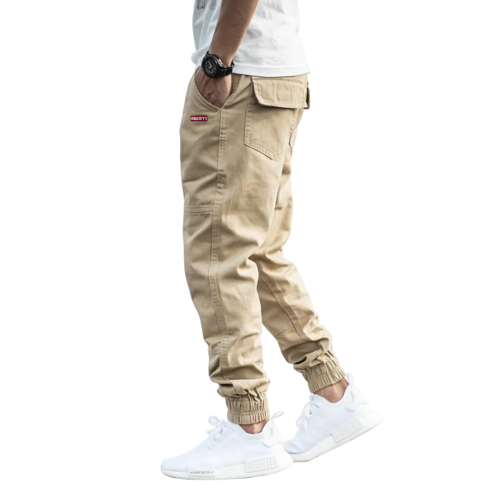 Beige cargo pants worn by a person on a white background